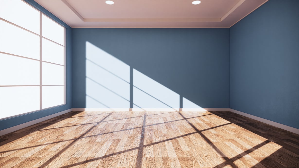 Empty Blue Room with Sunlight Through the Window